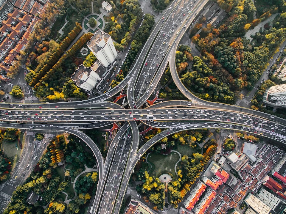 An aerial photo of a city and complex transportation channels